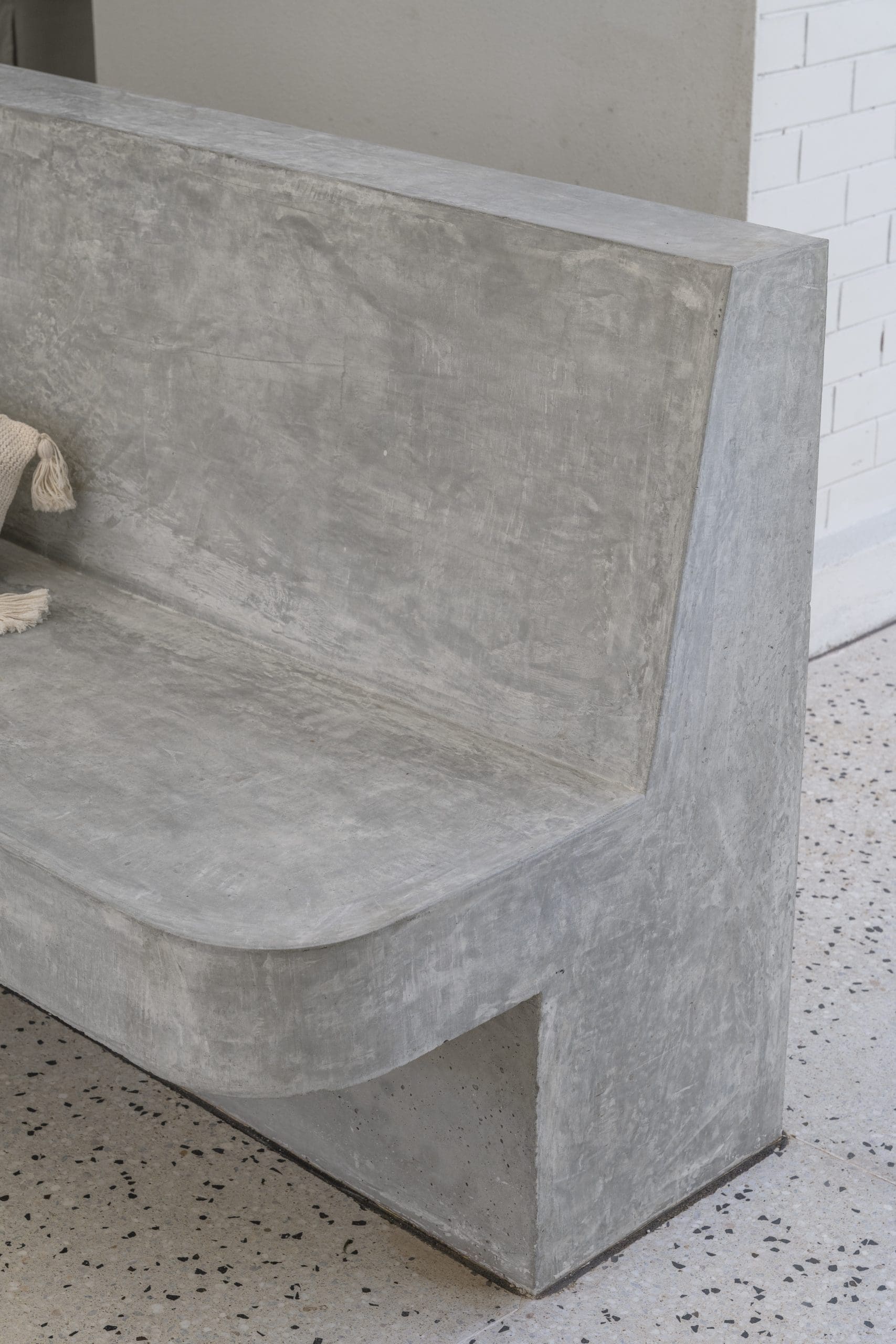 Built-in titanium honed concrete seating designed for outdoor living and entertaining in Glengowrie